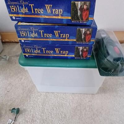 Brand new indoor / outdoor tree wrap lights with light up orb and a foot switch extension cord