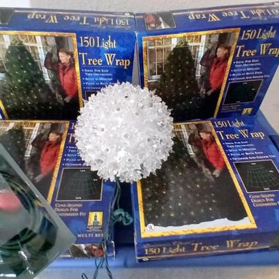 Brand new indoor / outdoor tree wrap lights with light up orb and a foot switch extension cord
