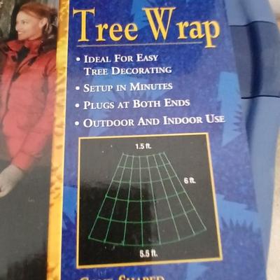 Brand new indoor / outdoor tree wrap lights with light up orb and a foot switch extension cord