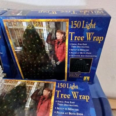 Brand new indoor / outdoor tree wrap lights with light up orb and a foot switch extension cord