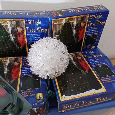Brand new indoor / outdoor tree wrap lights with light up orb and a foot switch extension cord