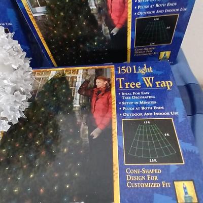 Brand new indoor / outdoor tree wrap lights with light up orb and a foot switch extension cord