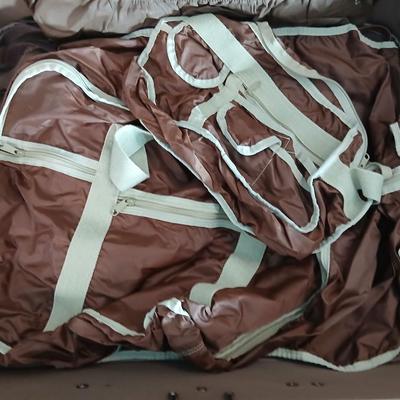 Suitcase with an assortment of bags and a two wheeled adjustable luggage cart