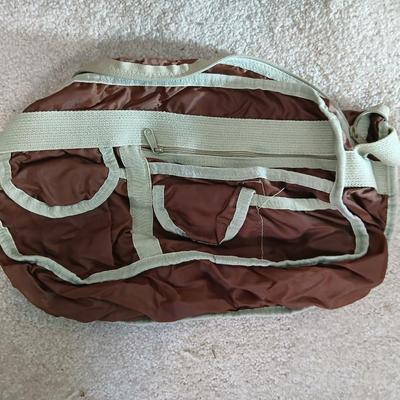 Suitcase with an assortment of bags and a two wheeled adjustable luggage cart
