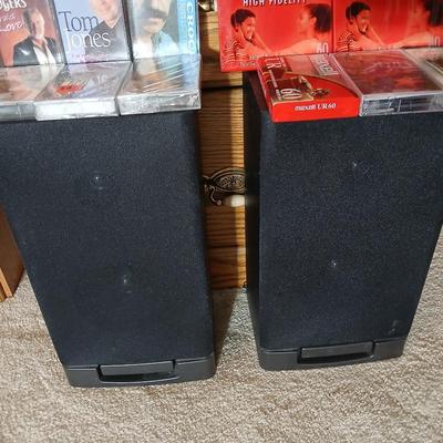 Stereo system CD player, Tuner, Dual cassette, Record player with 2 speakers and collection of cd's and cassettes