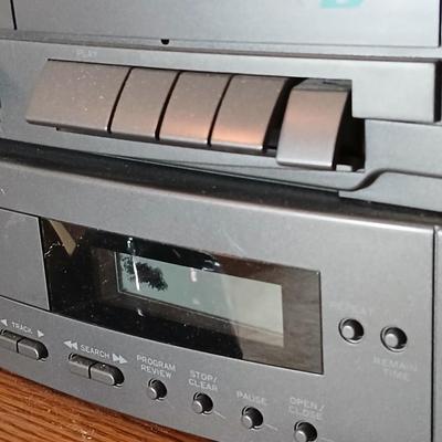 Stereo system CD player, Tuner, Dual cassette, Record player with 2 speakers and collection of cd's and cassettes