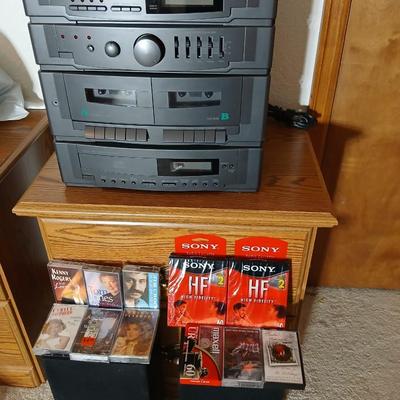 Stereo system CD player, Tuner, Dual cassette, Record player with 2 speakers and collection of cd's and cassettes