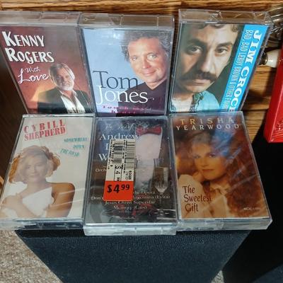 Stereo system CD player, Tuner, Dual cassette, Record player with 2 speakers and collection of cd's and cassettes