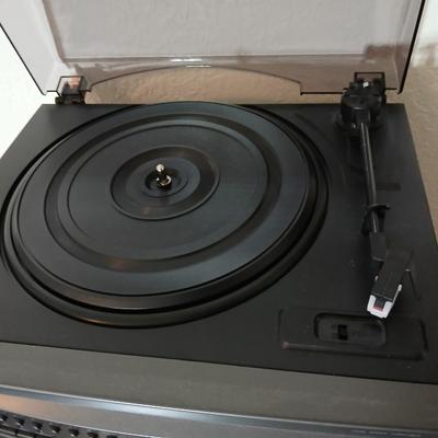 Stereo system CD player, Tuner, Dual cassette, Record player with 2 speakers and collection of cd's and cassettes
