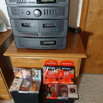 Stereo system CD player, Tuner, Dual cassette, Record player with 2 speakers and collection of cd's and cassettes