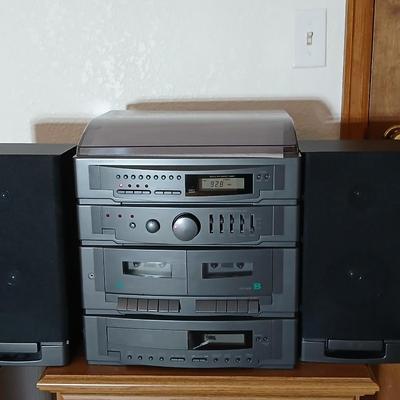 Stereo system CD player, Tuner, Dual cassette, Record player with 2 speakers and collection of cd's and cassettes