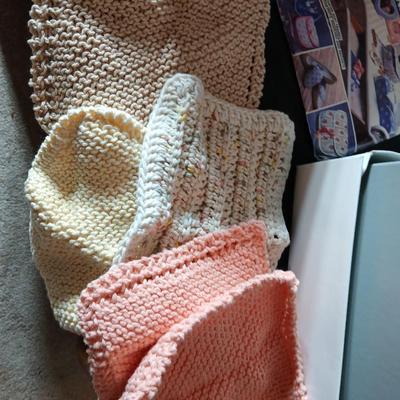 Skeins of yarn, new zippers, stretch lace edging, and other crafting / sewing items