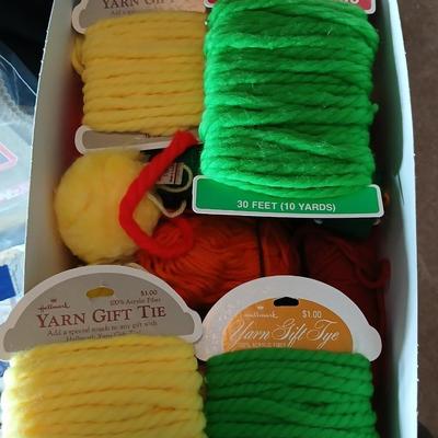 Skeins of yarn, new zippers, stretch lace edging, and other crafting / sewing items