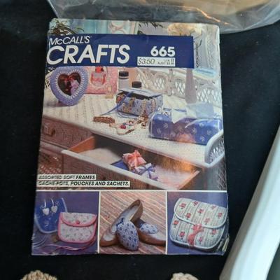 Skeins of yarn, new zippers, stretch lace edging, and other crafting / sewing items