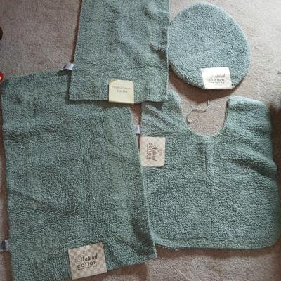 Brand new four-piece Green Mist bath rug set