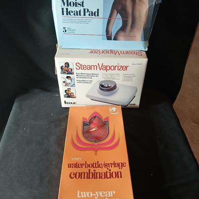 Kaz King size moist heat pad, Steam Vaporizer, and water bottle / sytinge combination