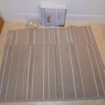 Two rubber backed rugs with a new shower curtain liner