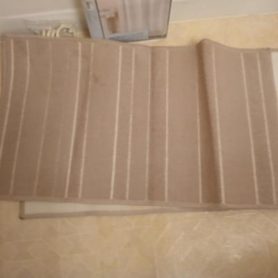 Two rubber backed rugs with a new shower curtain liner