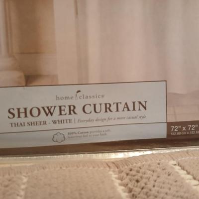 Two rubber backed rugs with a new shower curtain liner