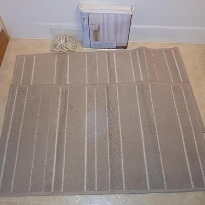 Two rubber backed rugs with a new shower curtain liner