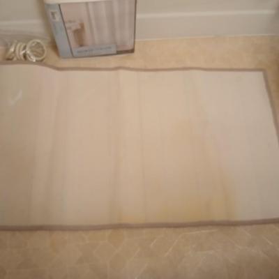 Two rubber backed rugs with a new shower curtain liner