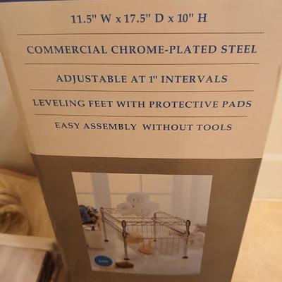Single basket organizer with chrome bathtub organizers and hooks