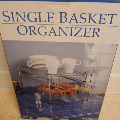 Single basket organizer with chrome bathtub organizers and hooks