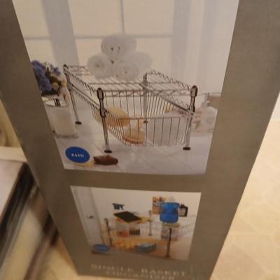 Single basket organizer with chrome bathtub organizers and hooks