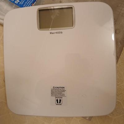 White organizing baskets Rubber tub mat Bathroom scale and other bathroom essentials