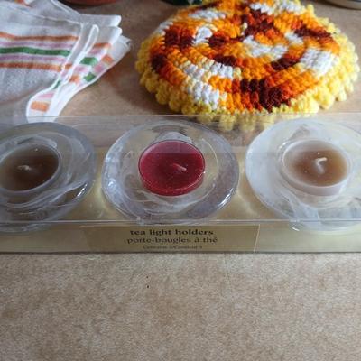Assortment of Kitchen items, Utensils with holder, towels, platter, candles and hot pads