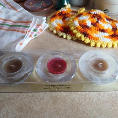 Assortment of Kitchen items, Utensils with holder, towels, platter, candles and hot pads