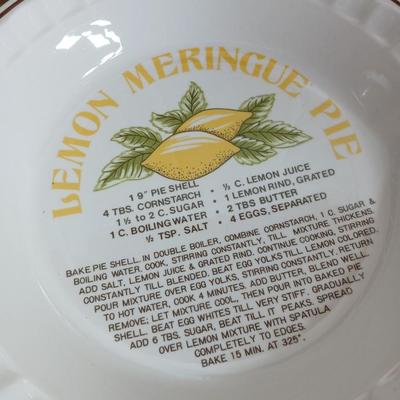 Two ceramic recipe pie dishes and one glass Pyrex pie dish