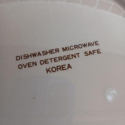 Two ceramic recipe pie dishes and one glass Pyrex pie dish