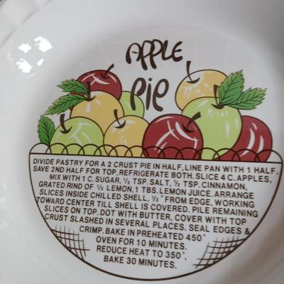 Two ceramic recipe pie dishes and one glass Pyrex pie dish