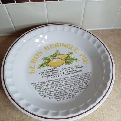 Two ceramic recipe pie dishes and one glass Pyrex pie dish