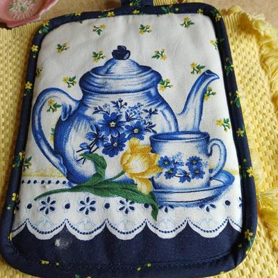 Neat enamel yellow tea pot with star fun mugs and tea themed towels to match