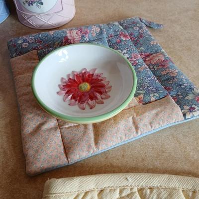 Small metal kitchen canister set with new kitchen towels and hot hand pad