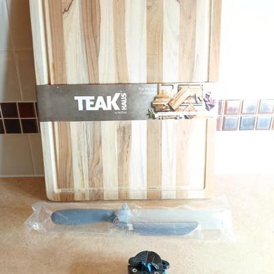Brand new Teak cutting board with new adjustable slice knife and knife sharpener