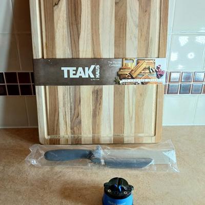Brand new Teak cutting board with new adjustable slice knife and knife sharpener