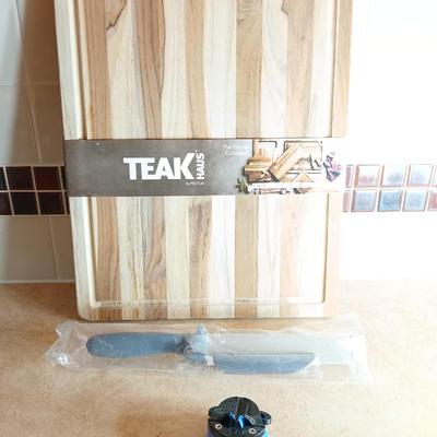 Brand new Teak cutting board with new adjustable slice knife and knife sharpener