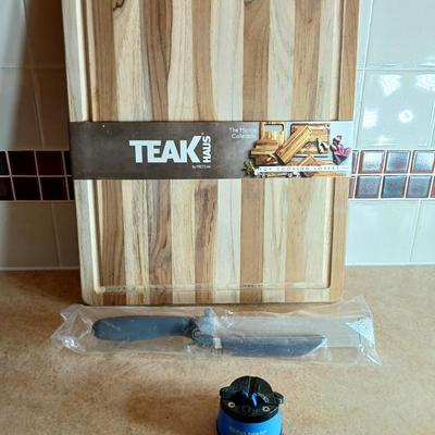 Brand new Teak cutting board with new adjustable slice knife and knife sharpener