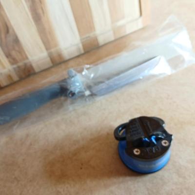 Brand new Teak cutting board with new adjustable slice knife and knife sharpener
