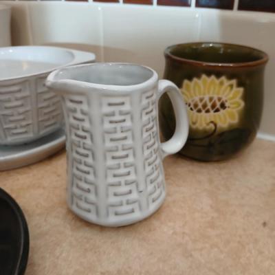 Small stoneware like Kitchen bowls and mugs with neat design