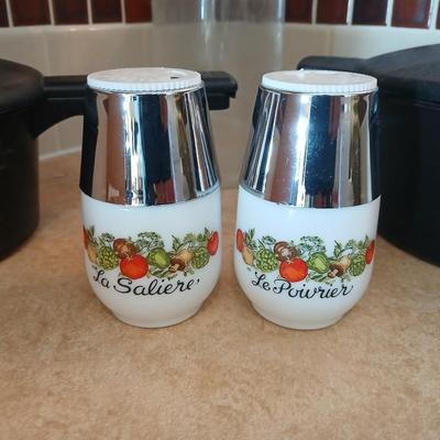 Pampered Chef pasta bowls with strainer lids, a glass spaghetti noodle canister and Italian themed salt & pepper shakers