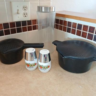 Pampered Chef pasta bowls with strainer lids, a glass spaghetti noodle canister and Italian themed salt & pepper shakers