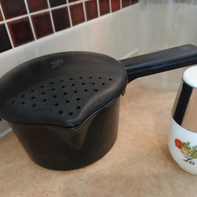 Pampered Chef pasta bowls with strainer lids, a glass spaghetti noodle canister and Italian themed salt & pepper shakers