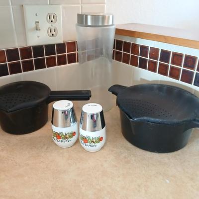 Pampered Chef pasta bowls with strainer lids, a glass spaghetti noodle canister and Italian themed salt & pepper shakers