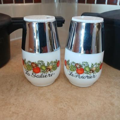 Pampered Chef pasta bowls with strainer lids, a glass spaghetti noodle canister and Italian themed salt & pepper shakers