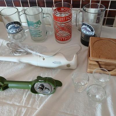 Glass beer mugs, can opener, Shit glasses, and a nice Drink mixer for your bar!