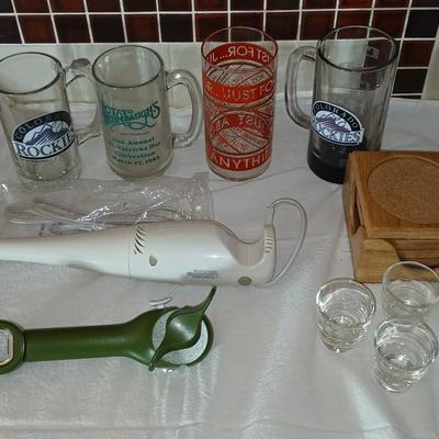 Glass beer mugs, can opener, Shit glasses, and a nice Drink mixer for your bar!